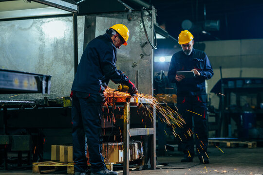 Manual worker in workshop supervised.