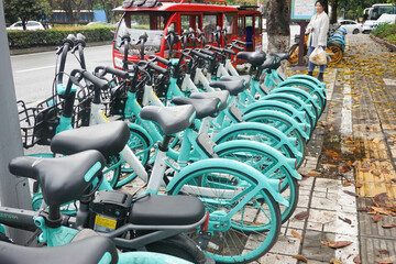 A Row of Bicycle for Rent with Bike-Sharing Apps in China