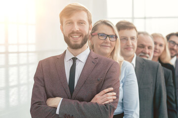 close up. smiling business people standing in one after another.