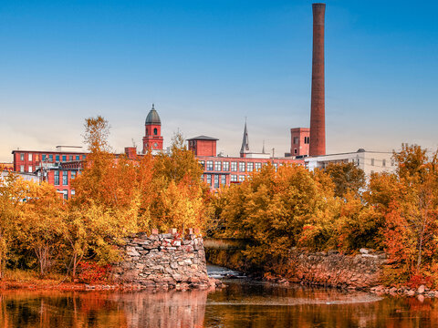 Old factory city in Autumn. Lewiston, Maine clear sky. Landscape background photography