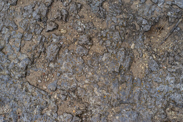 imagen detalle suelo de piedra de distintas alturas con arena en las grietas 