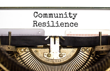 Community resilience symbol. Concept word Community resilience typed on retro old typewriter. Beautiful white background. Business and community resilience concept. Copy space.