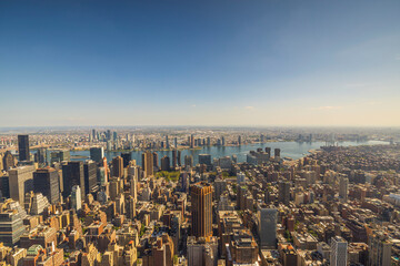 Panoramic view till down with of Empire State Building on skyscrapers buildings Manhattan. New York, USA. - obrazy, fototapety, plakaty
