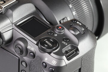Close up top panel of professional Mirrorless Digital Camera, DSLR, show on camera mode command...