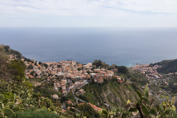 Panormaic view on Taormina town on top of a hill in Sicily on beautiful day