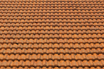 roof section of brown ceramic tiles on a sunny day