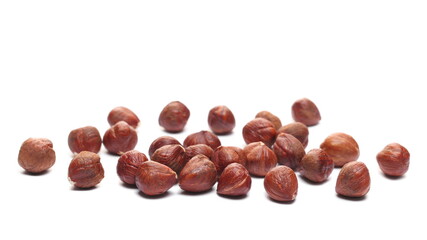 Peeled hazelnuts isolated on white, side view