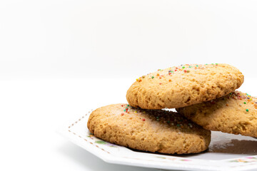 Stack of cookies on plate, selective focus, copy space, product