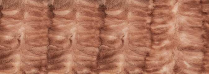 woolen red background. fleecy pink texture. the concept of wool products. fur soft purple surface