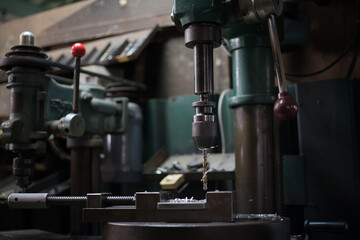 Part machining with drilling machine