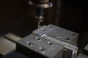 Fototapeta na wymiar Parts processing at machining center