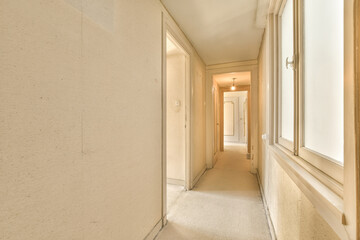 an empty hallway with no one person in the room to be seen on the right, and another view from the left