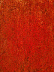 Metallic background or texture of rusty iron plate in reddish tone 