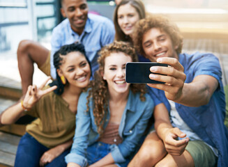 Good times selfie. a group of students taking a selfie on campus.