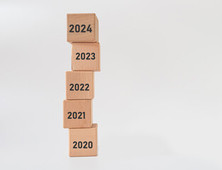 Hand translated wooden cube from 2023 to 2024. new business goal strategy concept.2024 goal planning business concept