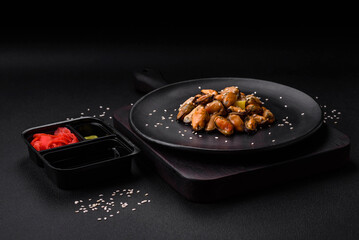 Delicious marinated mussels with spices and herbs on a ceramic plate