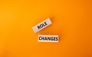 Role changes symbol. Concept words Role changes on wooden blocks. Beautiful orange background. Business and Role changes concept. Copy space.