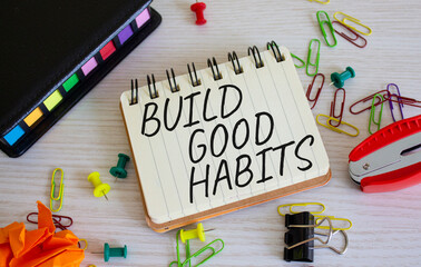 Build good habits symbol. Concept words Build good habits on white notebook. Beautiful wooden background. Business and Build good habits concept. Copy space.