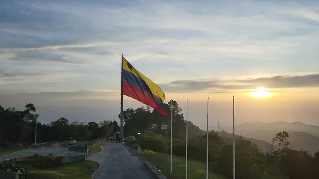 Venezuela Waving Flag Against Cloudy Sky