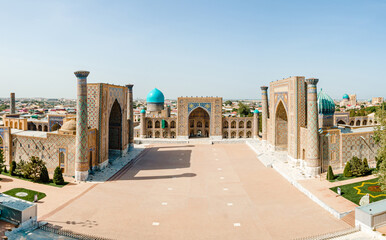 Fototapeta premium Samarkand, Uzbekistan aerial view of The Registan Square. Ulugh Beg Madrasah and the Tilya-Kori Madrasah a popular tourist attraction of Central Asia.