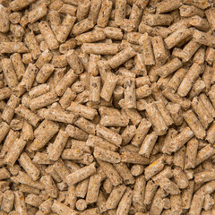 Close-Up Looped Rotation of Compacted Wooden Sawdust Pellets - Natural Cat Litter Filler or Organic Fuel. Big, Long Brown Pebbles. Products for Pets