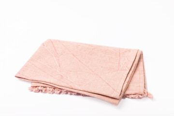Kitchen towel .Pink napkin isolated on white background. Picnic towel. Home textiles. Folded cloth.Food serving design element. Square napkin.
