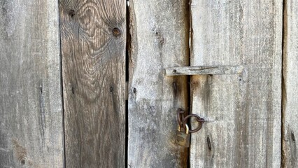 neglected rural country door with a padlock