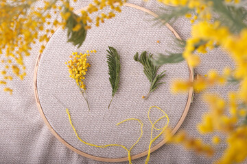 Spring concept of creativity and needlework. As if embroidered with yellow threads, lively bright...