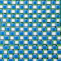 A checkerboard pattern of squares in shades of blue and green, with a central diamond shape in white5, Generative AI