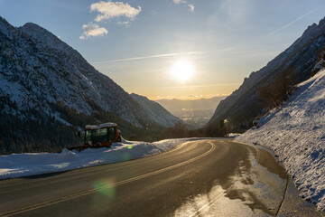 Snow plow along side of highway on the drive up Little Cottonwood Canyon in Utah