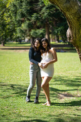 Fototapeta premium Happy pregnant lesbian couple at outdoors. LGBT