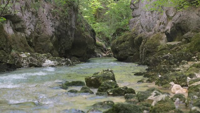River between rocks of a narrow gorge. Stream of water is squeezed between the sides of the rocks. Taubenlochschlucht, Taubenloch Gorge, Biel/Bienne, Switzerland