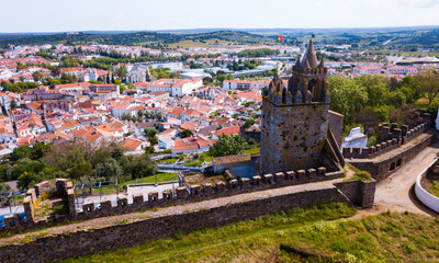 Aerial view of ruins of Montemor-o-Novo castle towering over settlement he once defended, Portugal