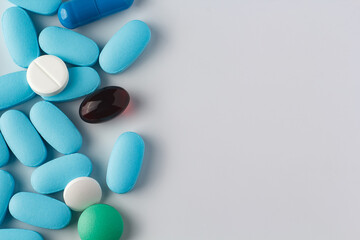 various pills on a light background, vitamins and medicine