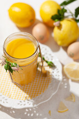 Homemade lemon curd on a light background