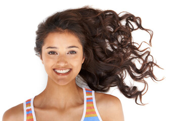 Fun and carefree. Pretty woman with curly hair smiling at the camera with isolated background.