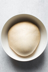 Bread dough that has doubled in size, dough that has risen, proofed dough in a bowl