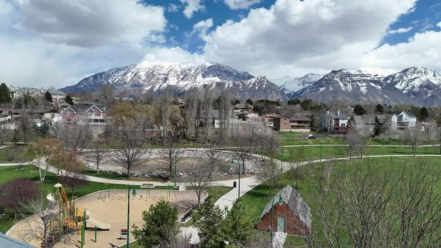 Aerial view flying over Nielsen's Grove Park in Orem Utah during Spring