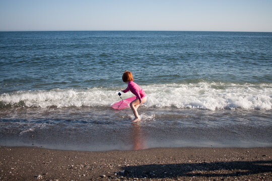 surfeando en la playa