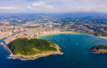Aerial panoramic view of summer seascape with La Concha Bay and coastal city of San Sebastian, Basque Country, Spain..