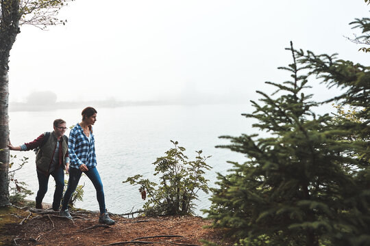 We still have so much to see. a young couple exploring nature together.