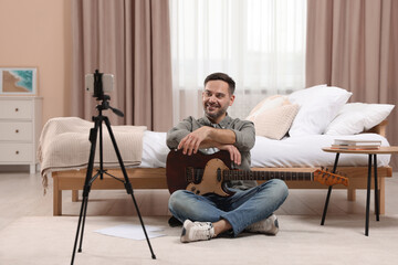 Music teacher talking with students while conducting online lesson at home. Time for hobby