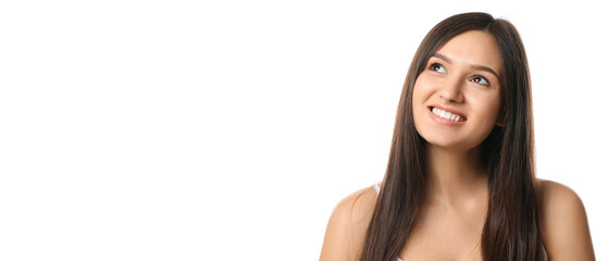 Beautiful smiling young woman with healthy teeth on white background with space for text