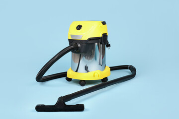 Fototapeta premium Vacuum cleaner on blue background