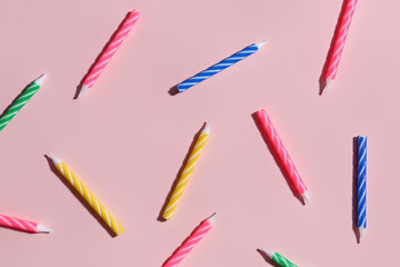 Birthday candles on pink background