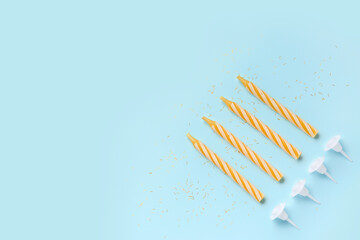 Birthday candles on blue background