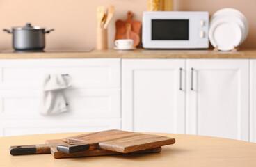 Cutting boards on wooden table in kitchen