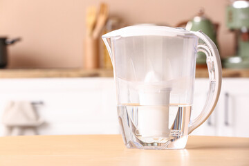 Modern filter jug on table in kitchen