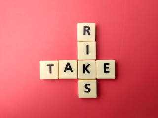 Toys word with the word TAKE RISK