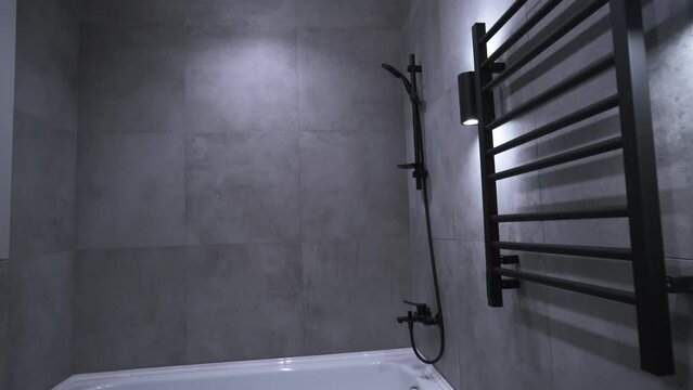 Modern bathroom interior. Gray tiles. Minimalistic interior design

